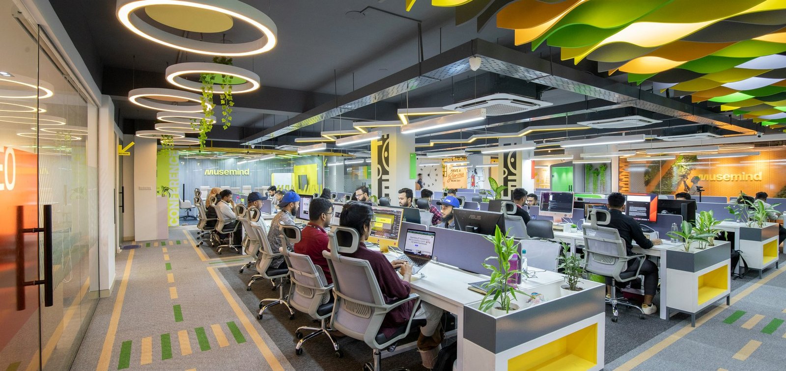 Professionally photographed collaborative office with organised desks and bright overhead lighting, representing the RentHub team available to respond to enquiries.