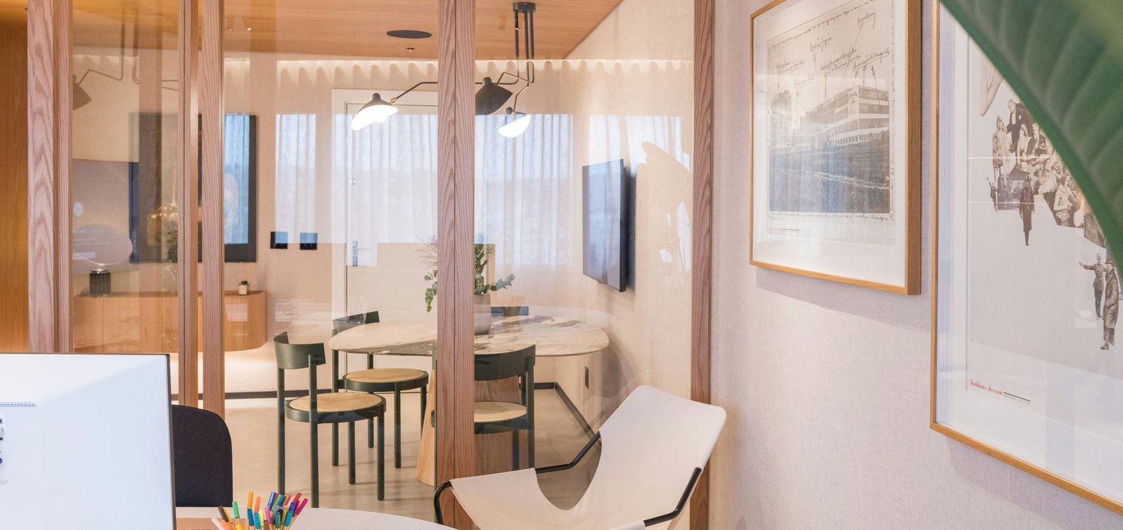 Professionally photographed modern office meeting area with glass partitions and clear workspaces, representing a careful property-information review process.